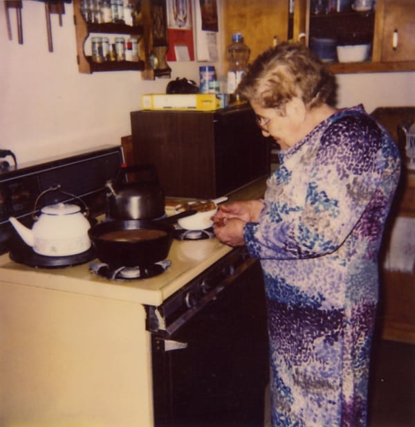 Grama Jesusita in front of stove making Mexican food