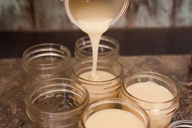 sweetened condensed milk pouring among the jars. 