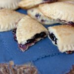 wild huckleberry empanadas on a blue cloth