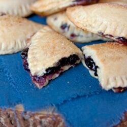 wild huckleberry empanadas on a blue cloth