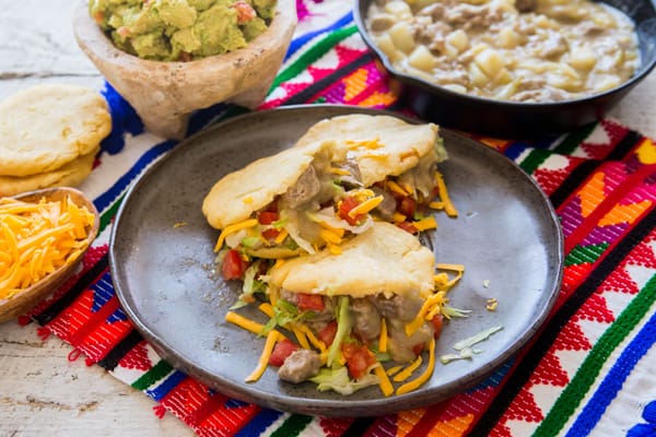 mexican gorditas on a grey plate.