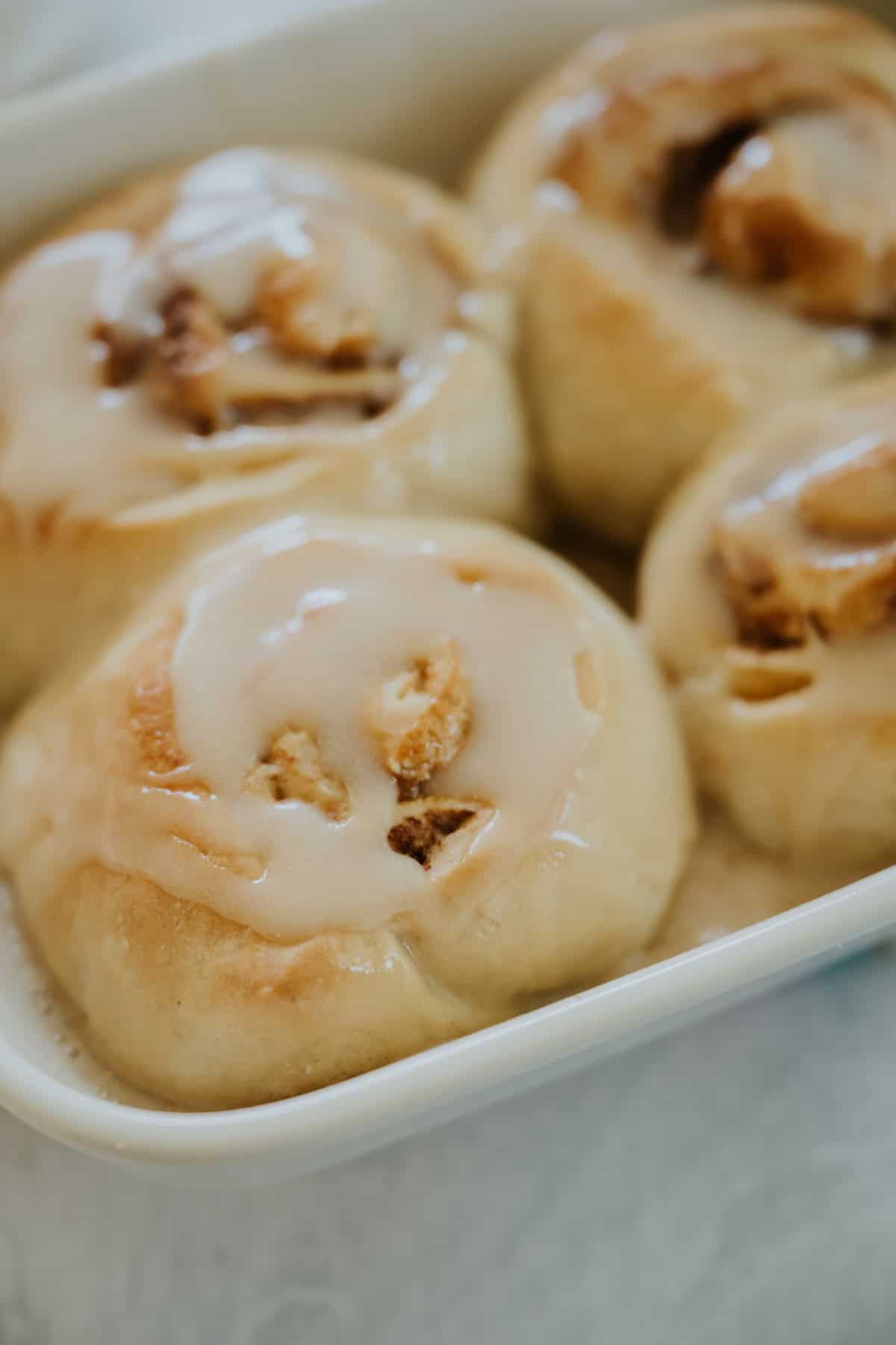 Baked Dulce de Leche and Pecan Cinnamon Rolls with a coffee glaze
