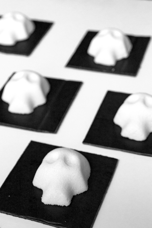 several undecorated sugar skulls drying overnight in the skull mold