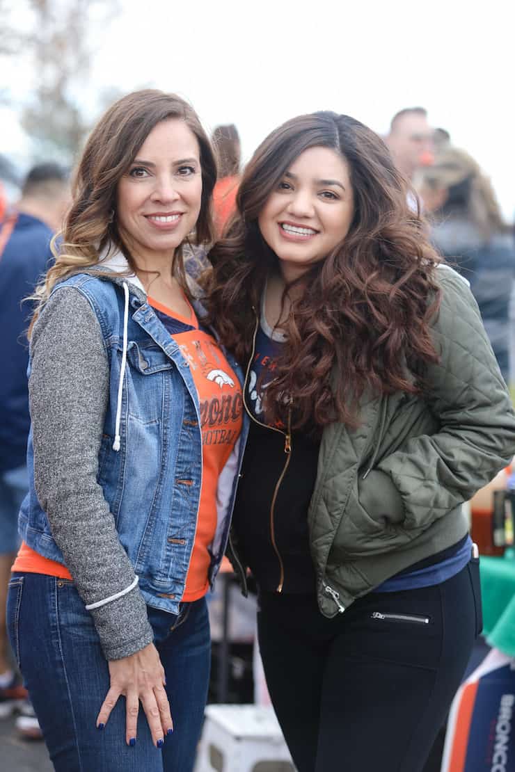 two Latina girls at a denver Broncos tailgate