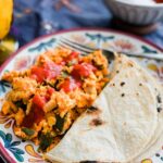 Huevo con Nopales en Chile Colorado ready and served in a colorful plate