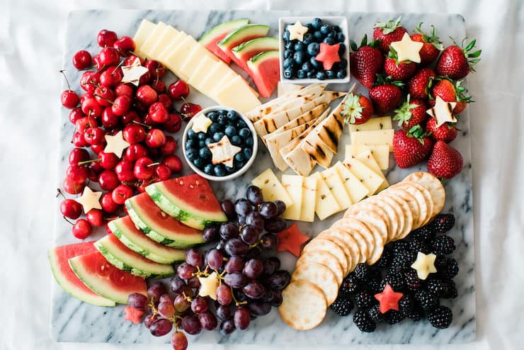 Delicious fruits and crackers served on a table