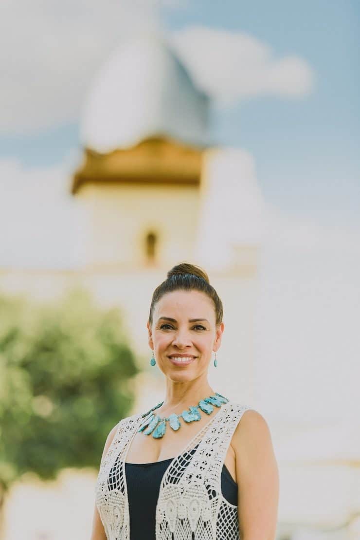 Yvette Marquez food travel blogger Ysleta mission in the background 