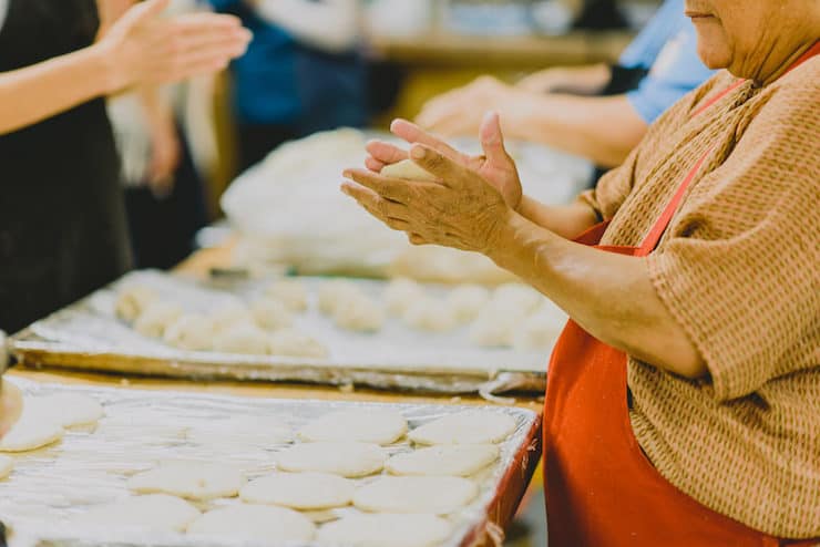 woman hands making Gorditas