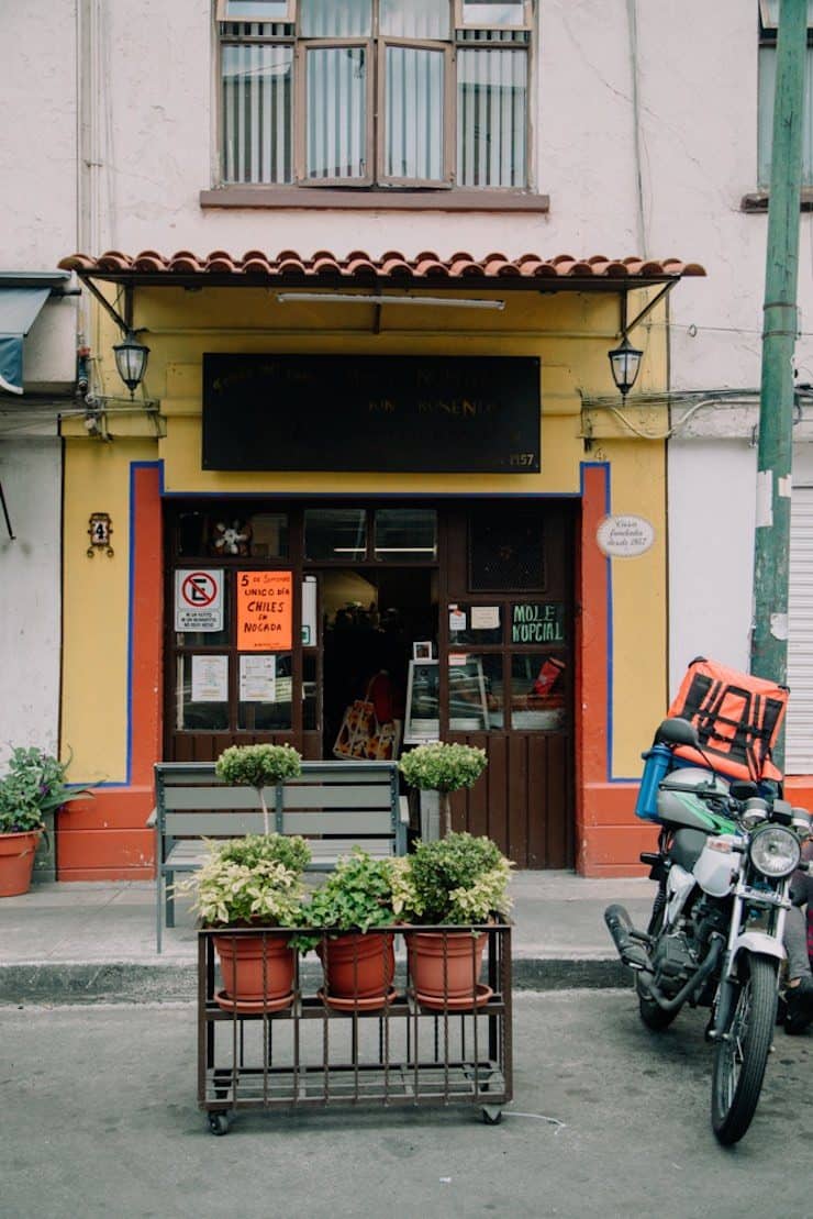 street view of a Mexican restaurant in Mexico City with a motorcycle in front
