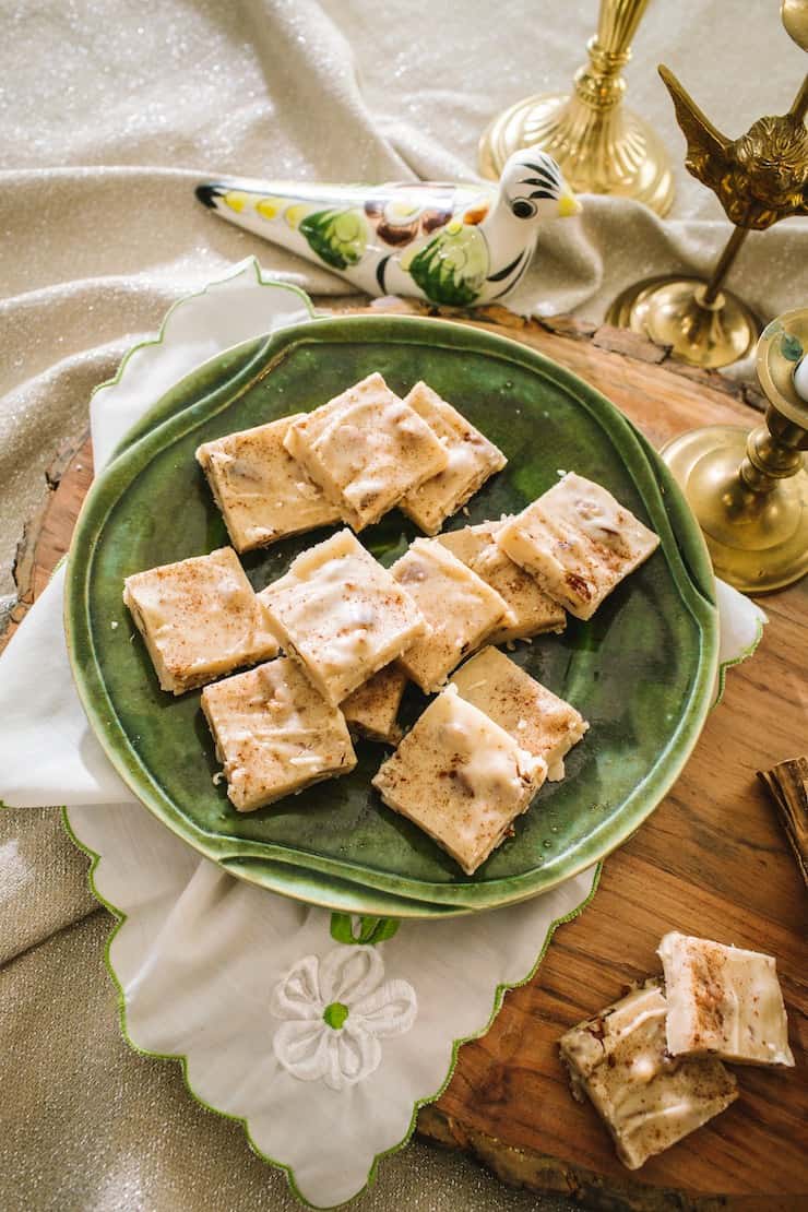Butter Pecan Bourbon Fudge on a green plate with Christmas decor