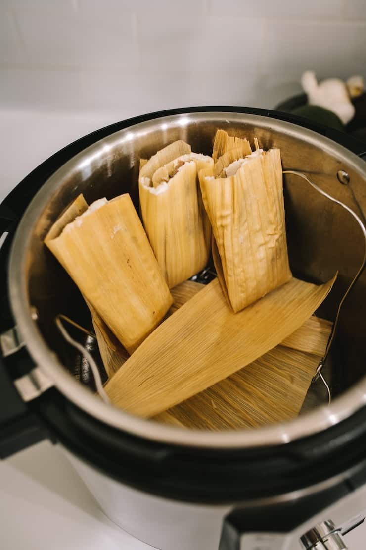 steaming tamales in an Instant Pot Pork and Roasted Green Chile Tamales