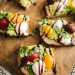 Heart-Healthy Caprese Avocado Toast served on a wooden board