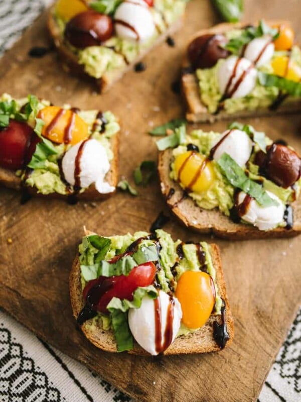 Heart-Healthy Caprese Avocado Toast served on a wooden board