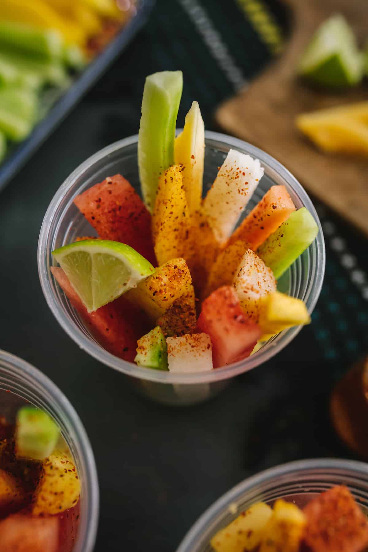 Mexican fruit cups sprinkled with Tajin.