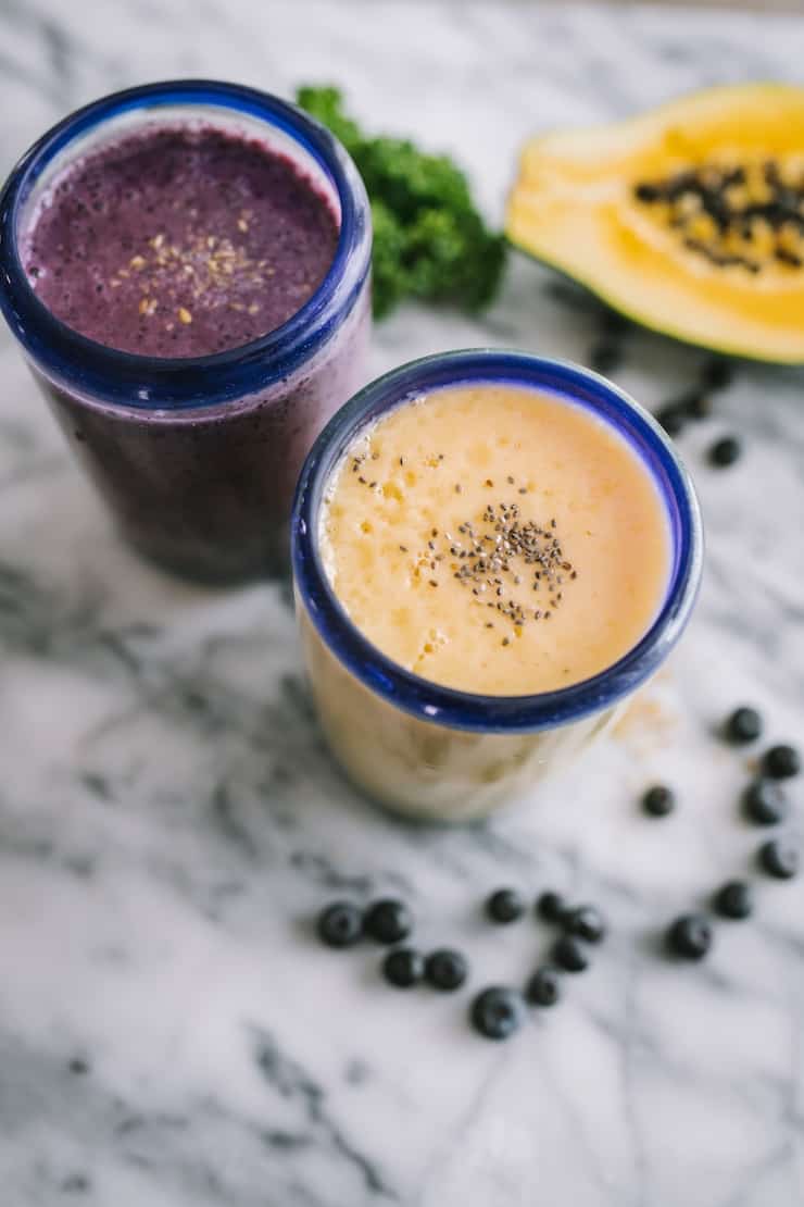 berry banana and tropical smoothies papaya and blueberries in background Smoothie Freezer Pack Recipes