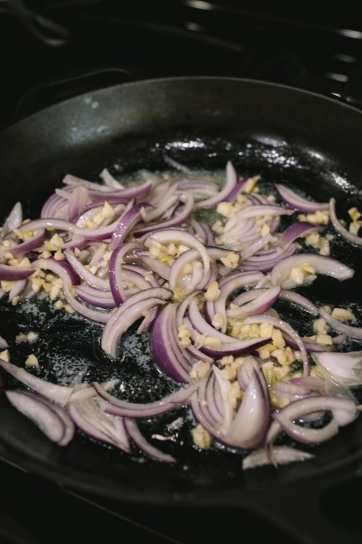saute garlic and onion for Camarones al Mojo de Ajo (Mexican-Style Garlic Shrimp)