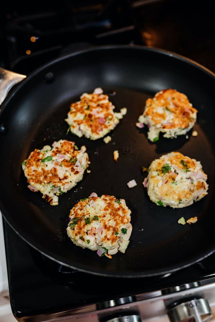 tuna patties lightly pan fried in a non-stick skillet