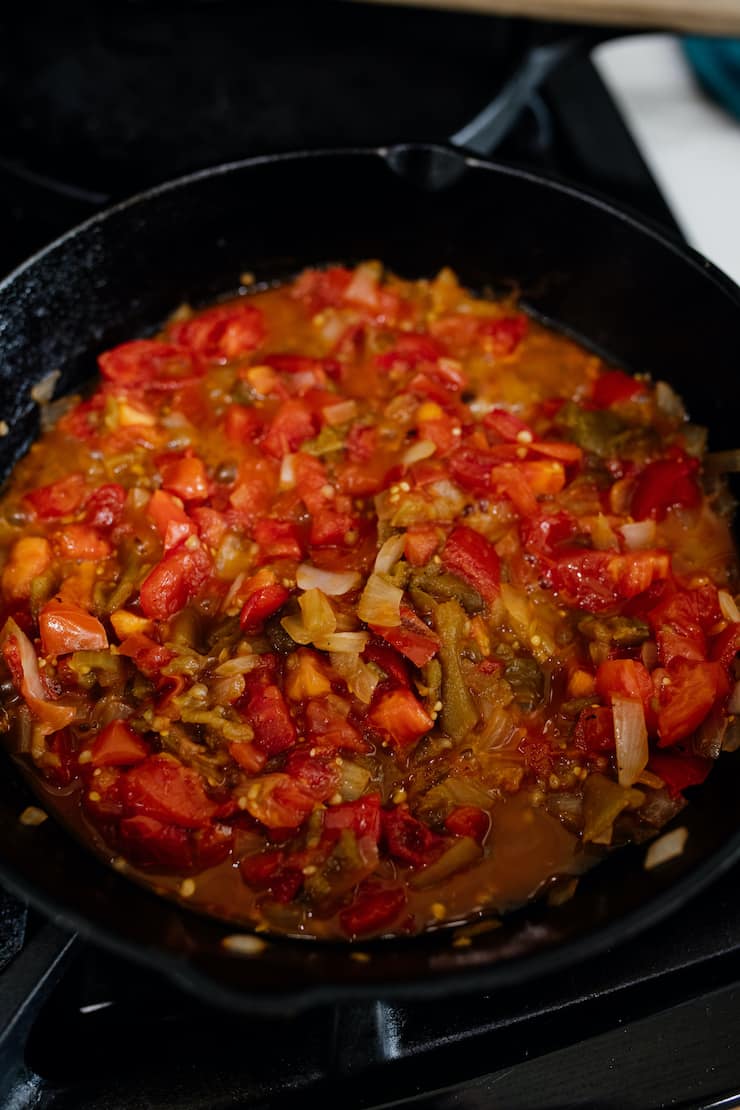 cooked salsa for huevos rancheros recipe in a cast iron skillet