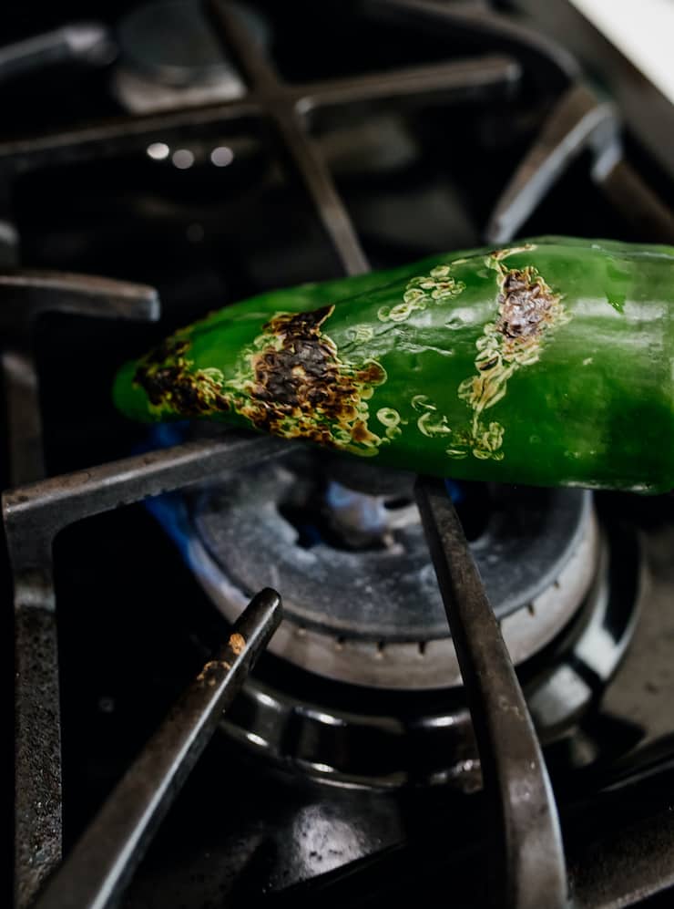 poblano roasting on a gas range. 