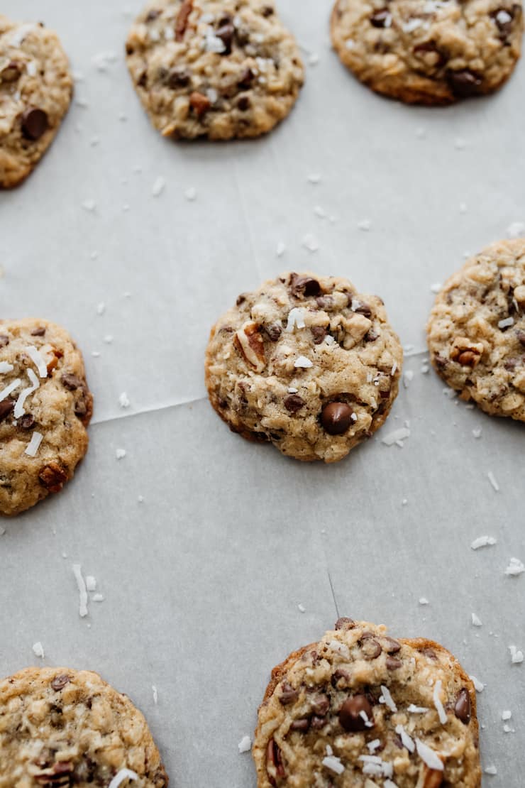 baked cowboy cookies on a parchment lined cookie sheet