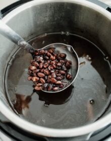 ladle of homemade Mexican style black beans from the Instant Pot