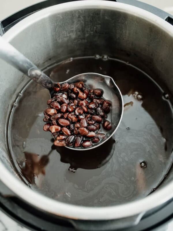 ladle of homemade Mexican style black beans from the Instant Pot