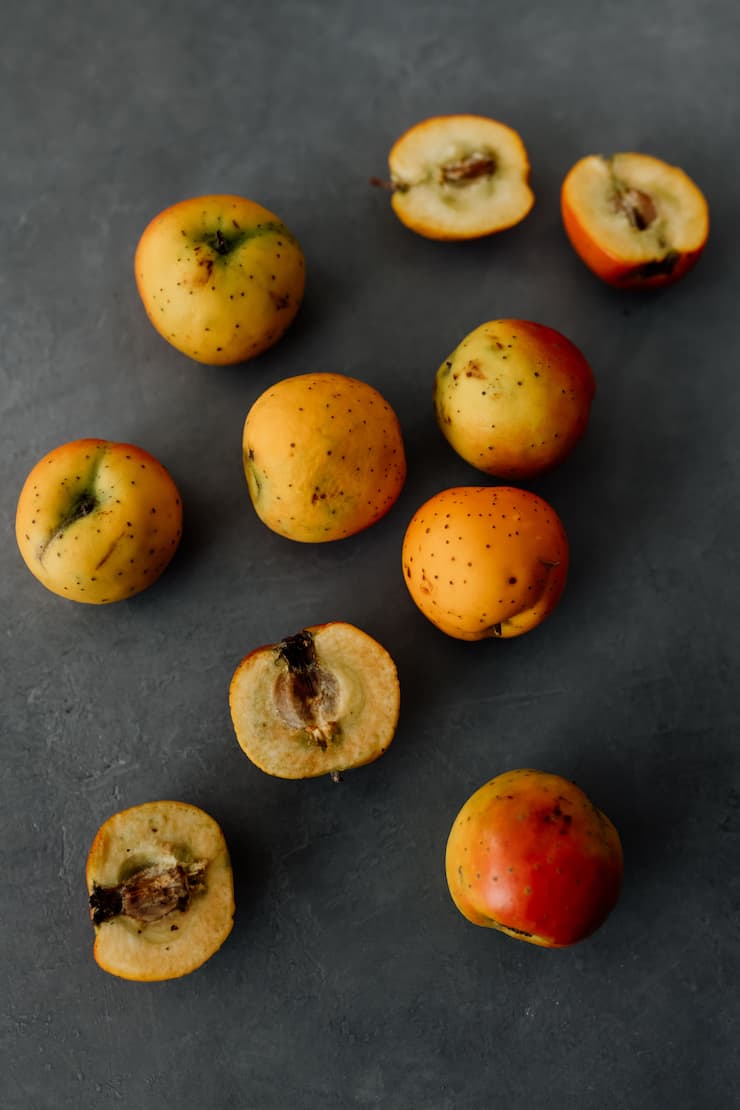 tejocotes (hawthorne apples) on a grey background