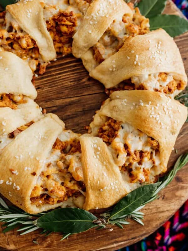 easy christmas breakfast crescent wreath on a wooden platter