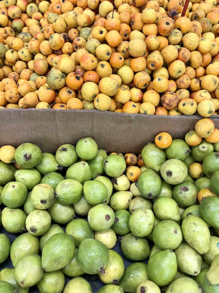 baskets of tejocotes (hawthorne apples) and guava at the supermarket