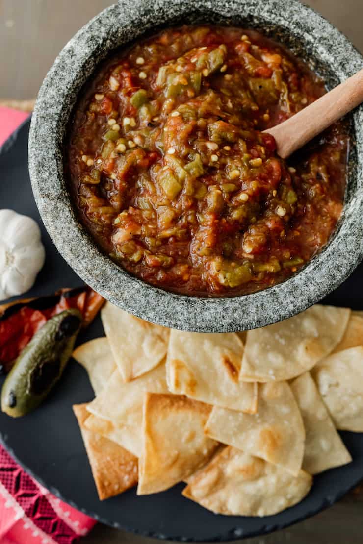 fire roasted tomato salsa with green chiles in a stoneware mortar with homemade tortilla chips