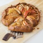 pie server pulling out a piece of apple galette