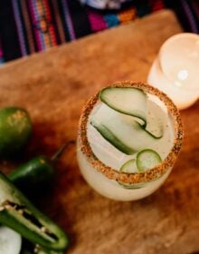 spicy cucumber margarita top down with a ribbon of cucumber