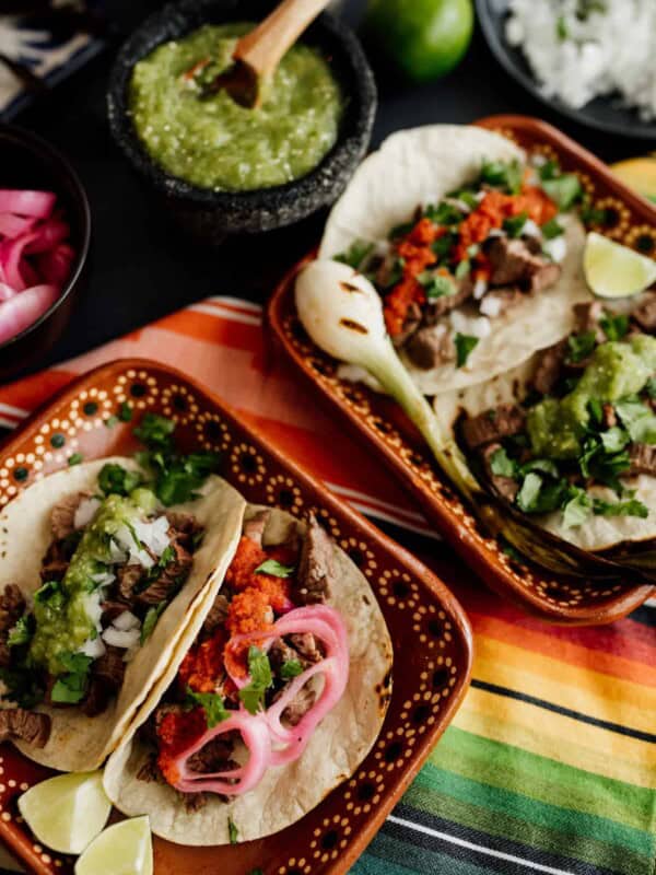 carne asada tacos on a colorful serape textile