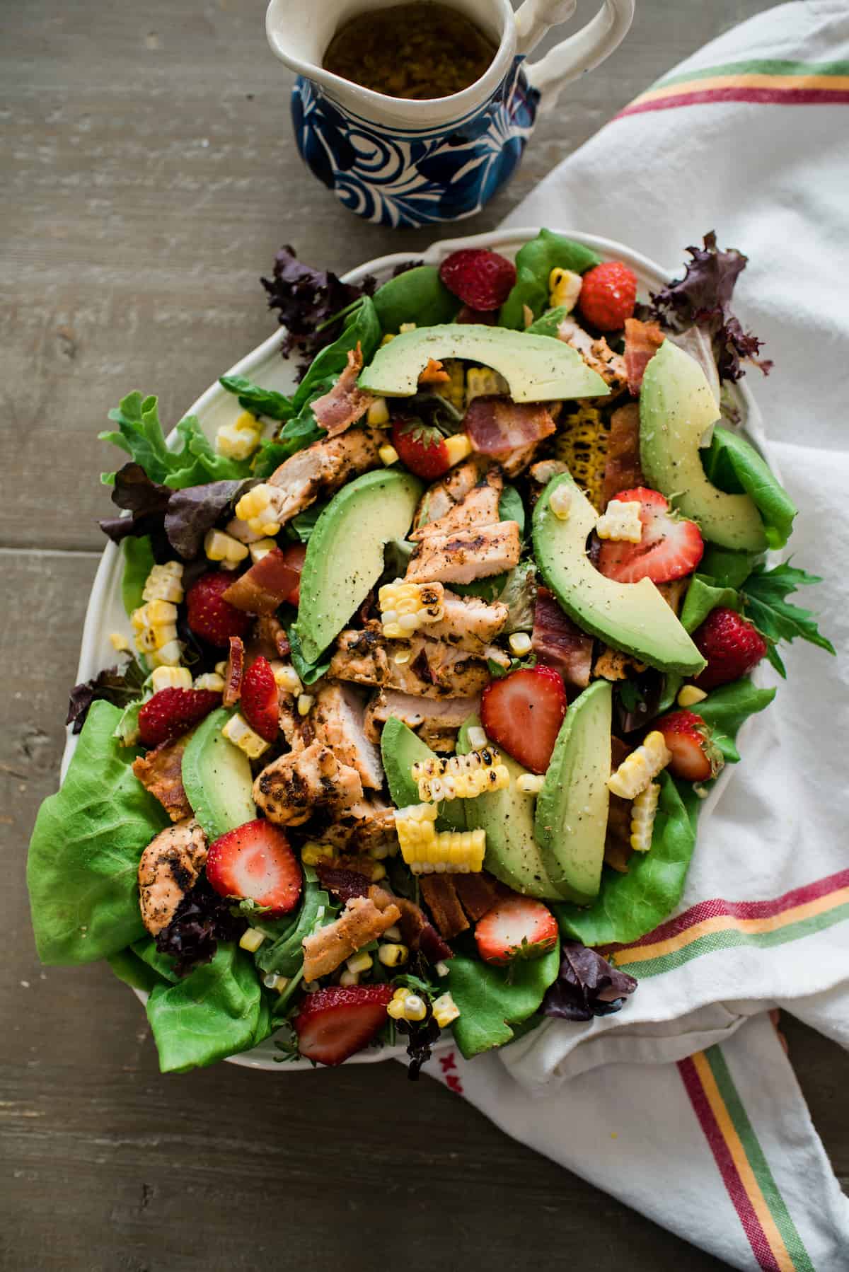 Mexican Cobb salad arranged on a large white serving platter
