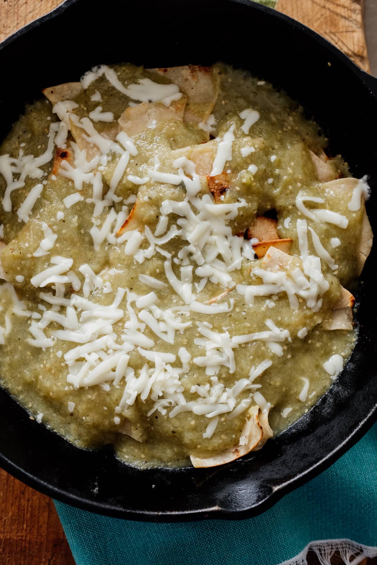 chilaquiles verde in a cast iron skillet