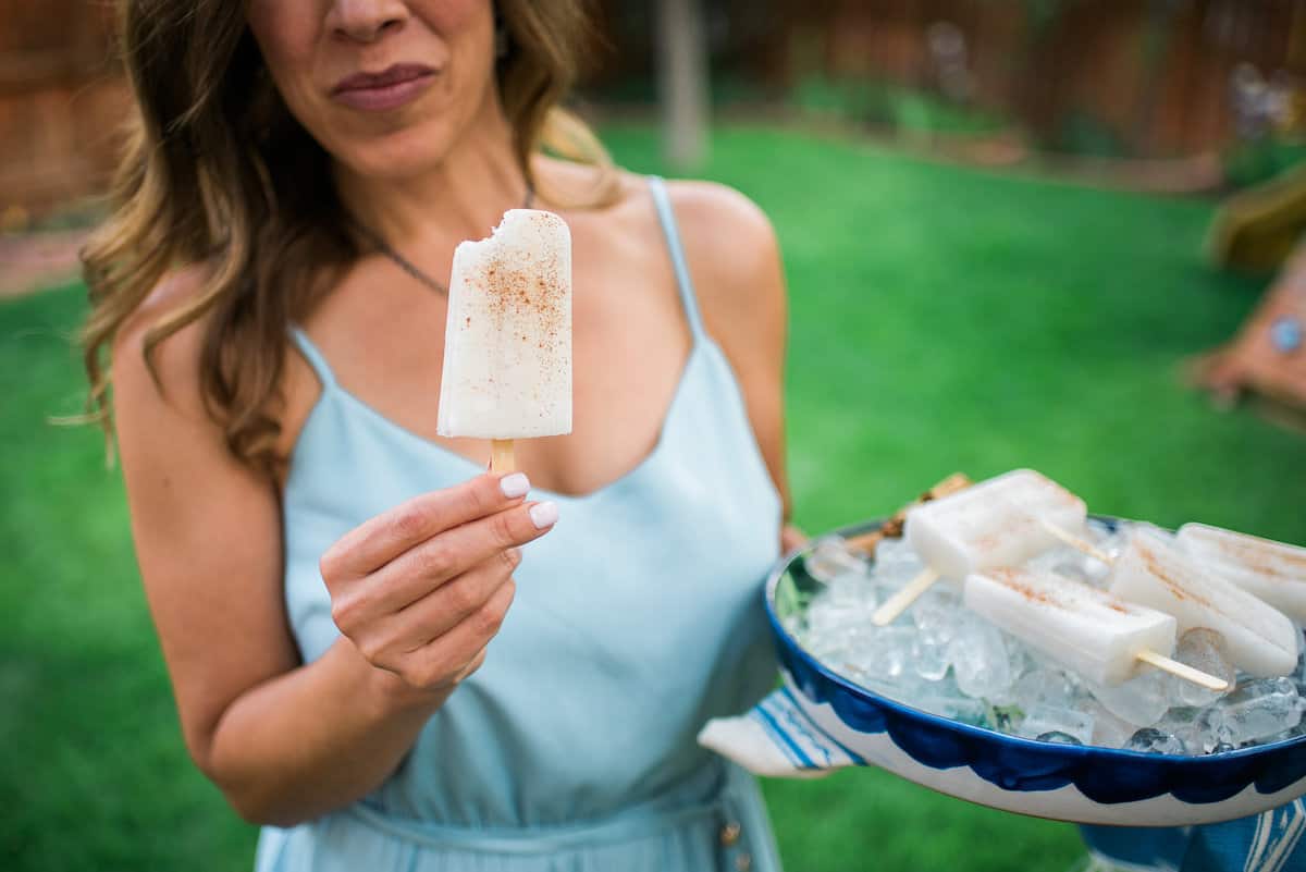 Yvette Marquez Latina food blogger holding an horchata Paletas popsicle