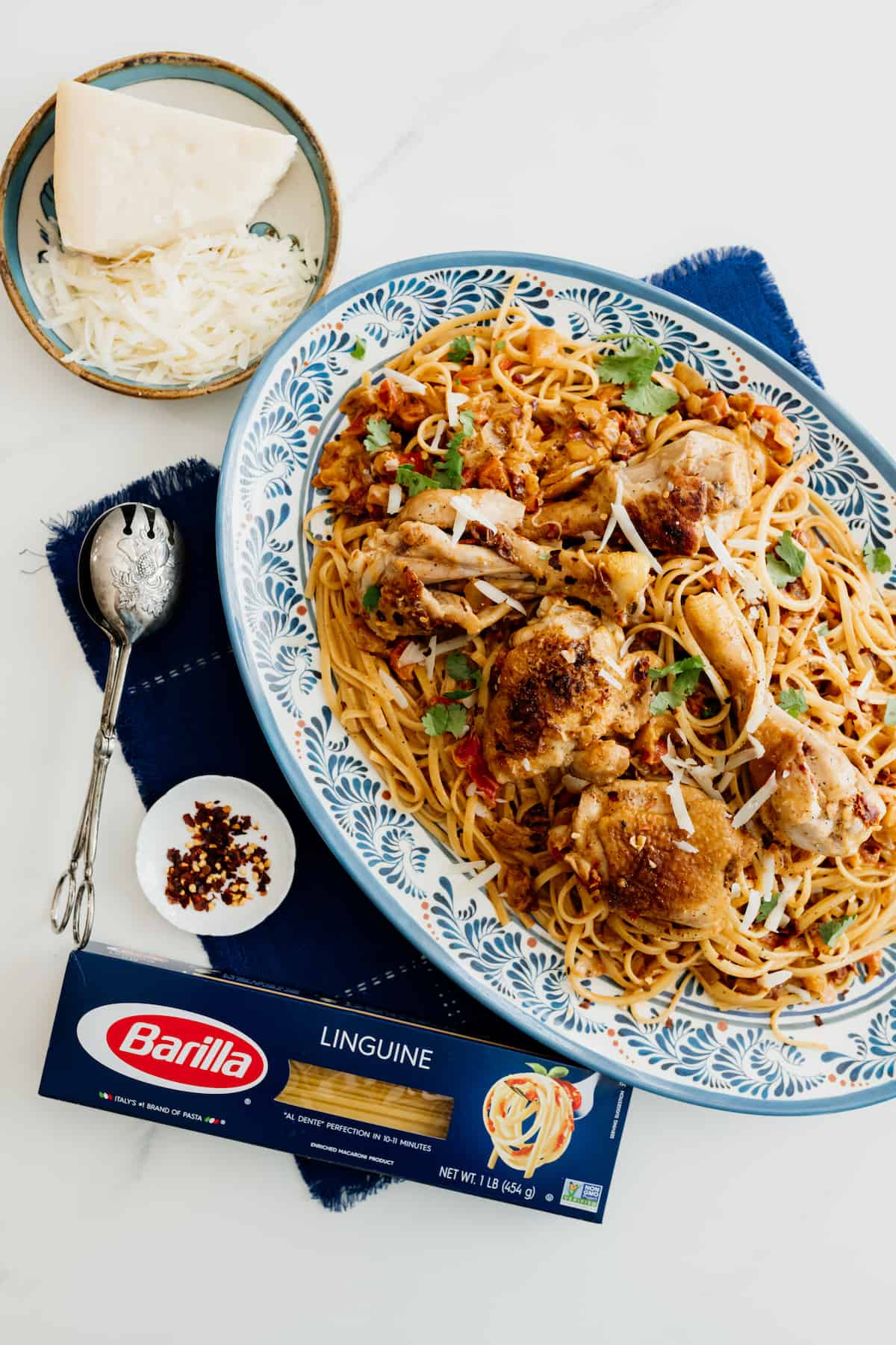 barilla linguine box on the side of a platter if chicken pasta
