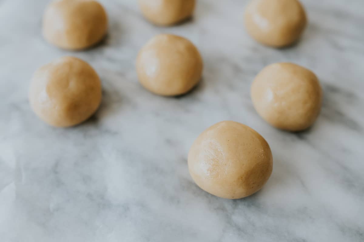 2- to 2½-inch dough balls on wax paper on marble