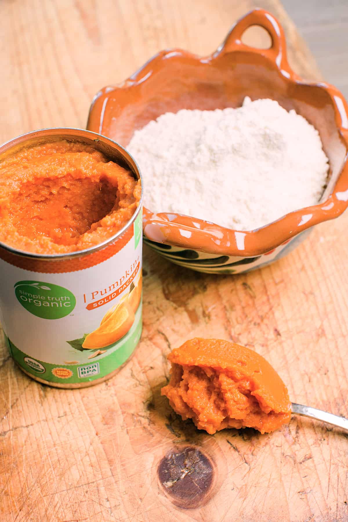 ingredients for pumpkin tamales pure pumpkin puree and a bowl of masa carina corn flour