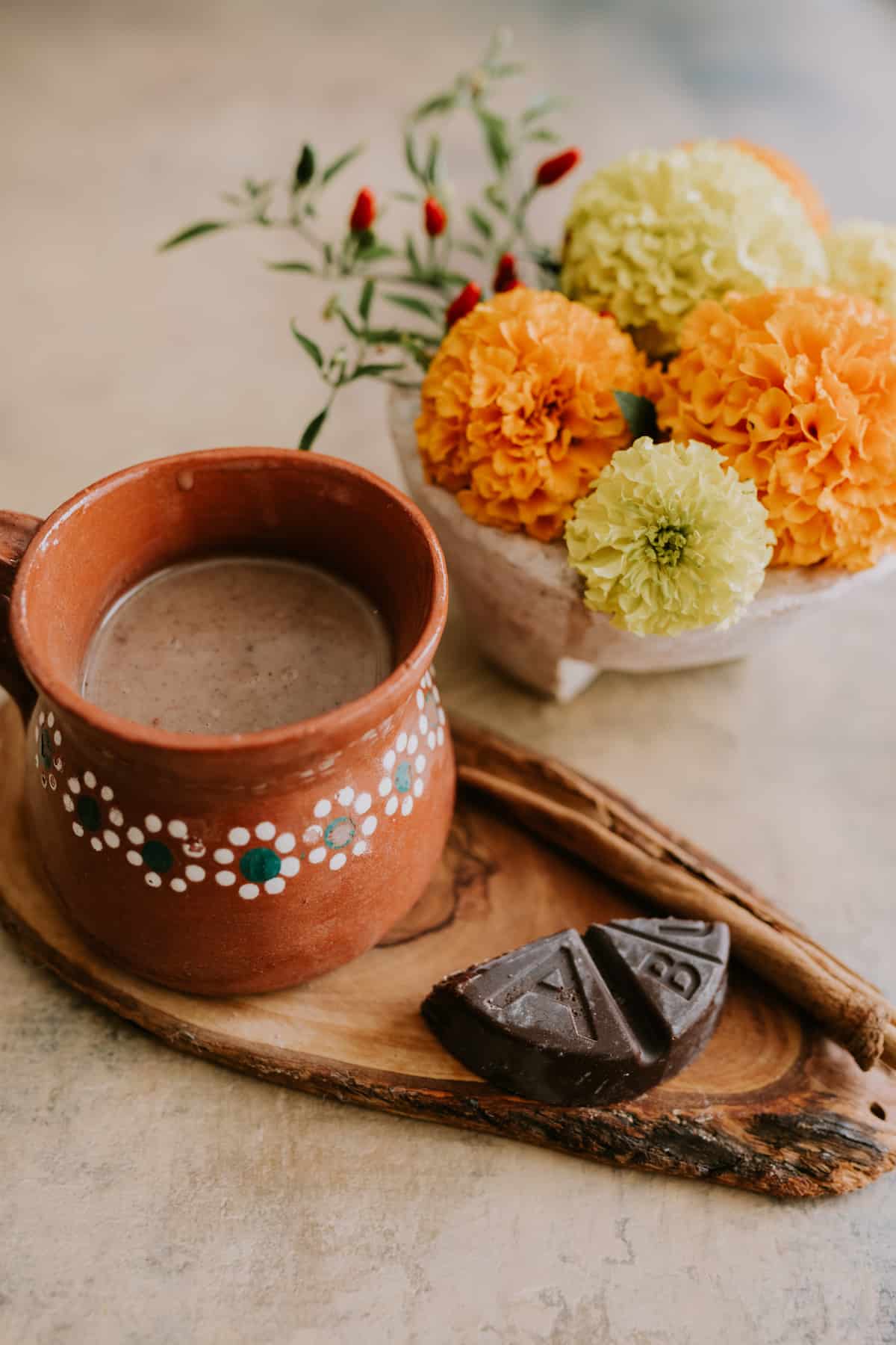 Mexican Hot Chocolate Abuelita cup with marigolds on the side