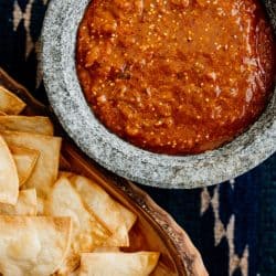 a bowl of this Roasted Tomatillo-Chipotle Salsa served with tortilla chips