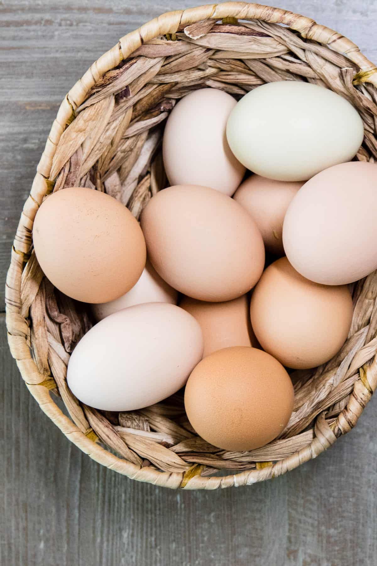 Farm Fresh Eggs in a brown wooden basket