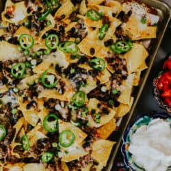 overhead shot of sheet pan nachos with ground beef and beans.