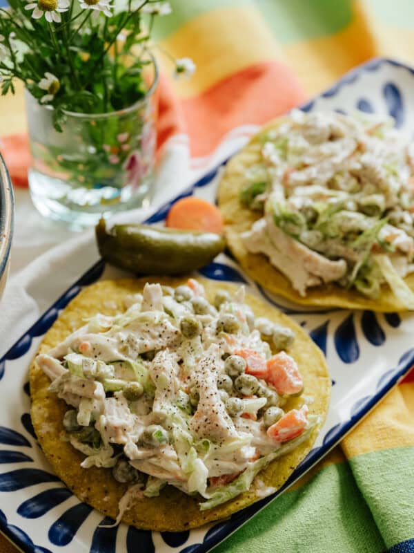 Mexican chicken salad (ensalada de pollo) on a tostada shell.