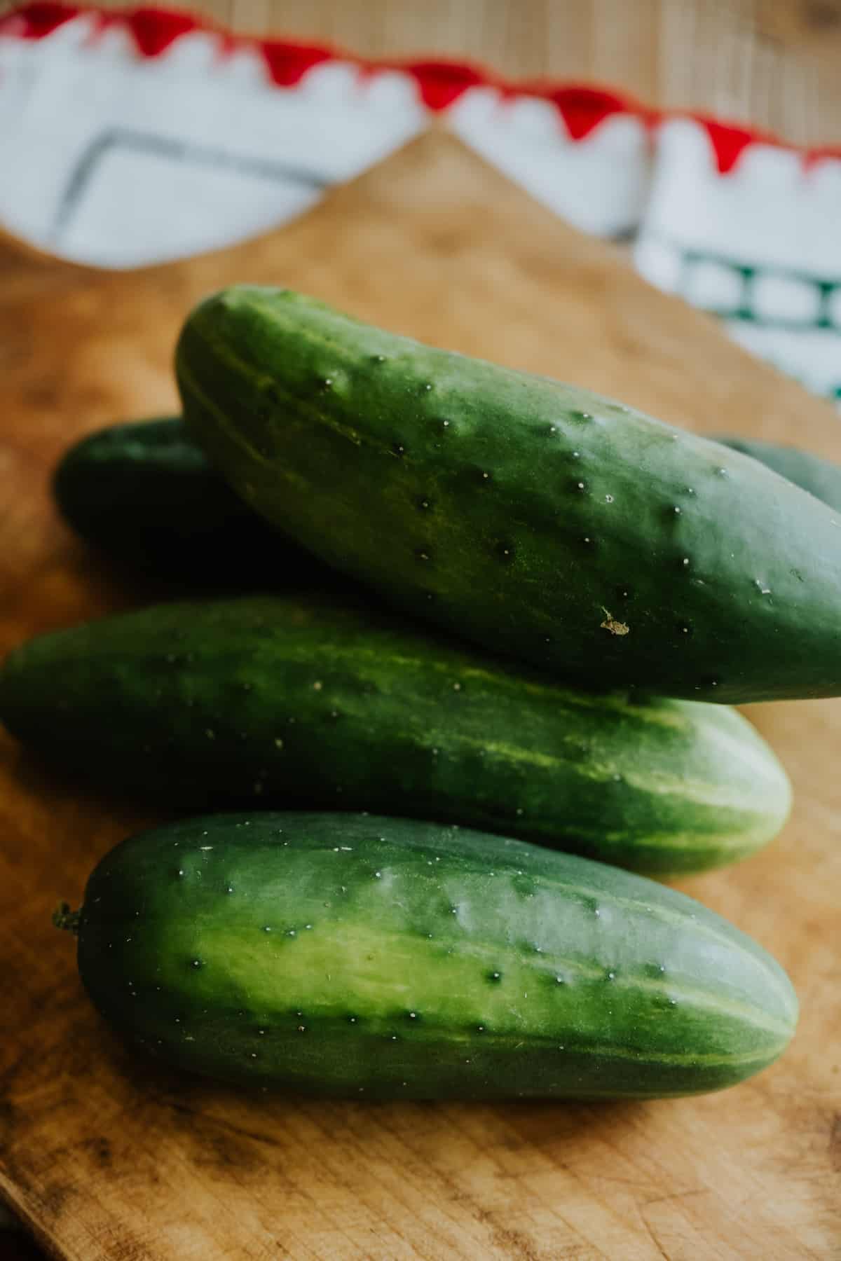 cucumbers on a cutting board. 