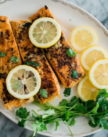 Lemon Butter Fish served with lemons and herbs