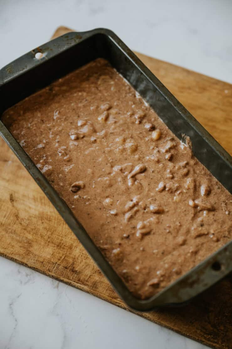 loaf tin filled with raw chocolate banana bread batter. 