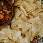 platter of homemade tortilla chips served with fresh salsa.