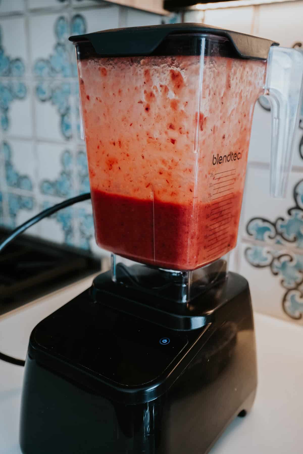 Homemade Mexican Chamoy Sauce blended in a blender with Spanish tile backsplash.