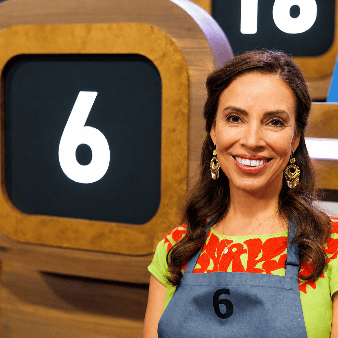 Yvette Marquez-Sharpnack, El Paso-born Mexican cookbook author, wearing contestant #6 apron on Food Network's 100 Cooks.